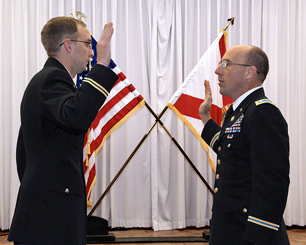Major Cody Khork taking an oath