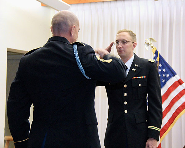 Major Cody Khork saluting an officer