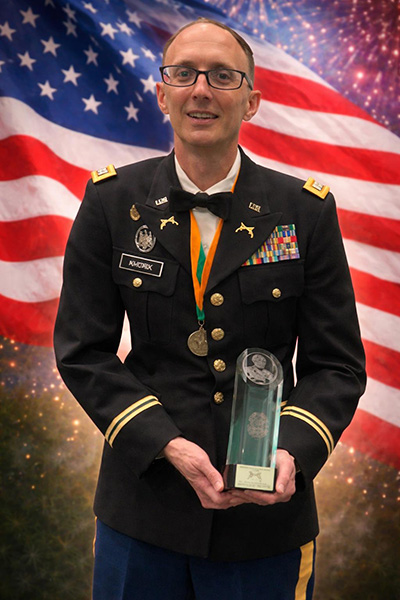 Major Cody Khork receiving an award