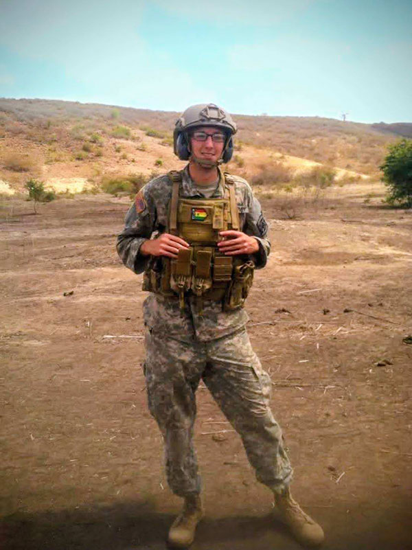 Major Cody Khork wearing tactical gear in a desert environment